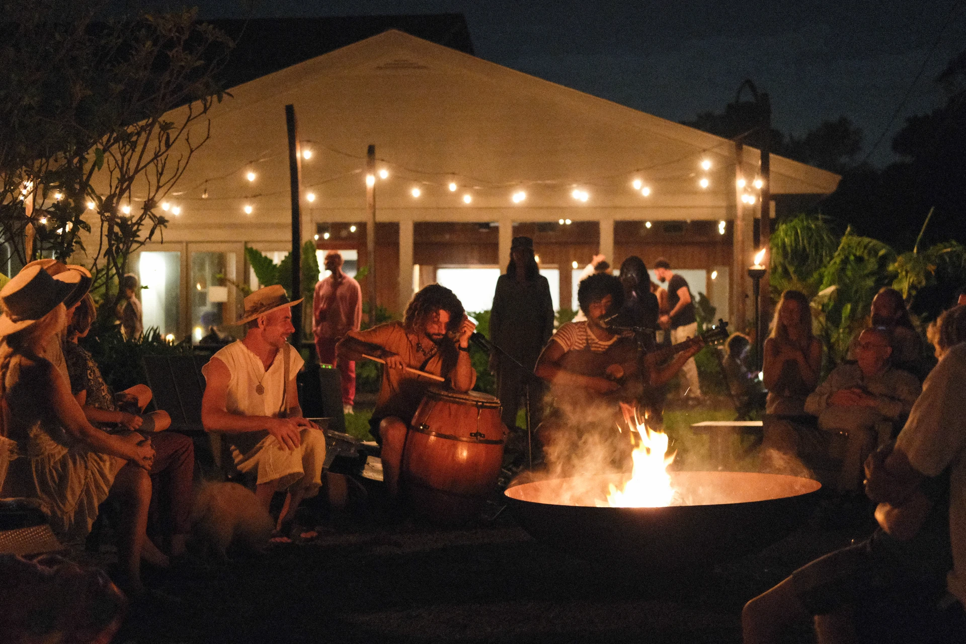 Musicians gathered around a fire outside the ChoZen lodge