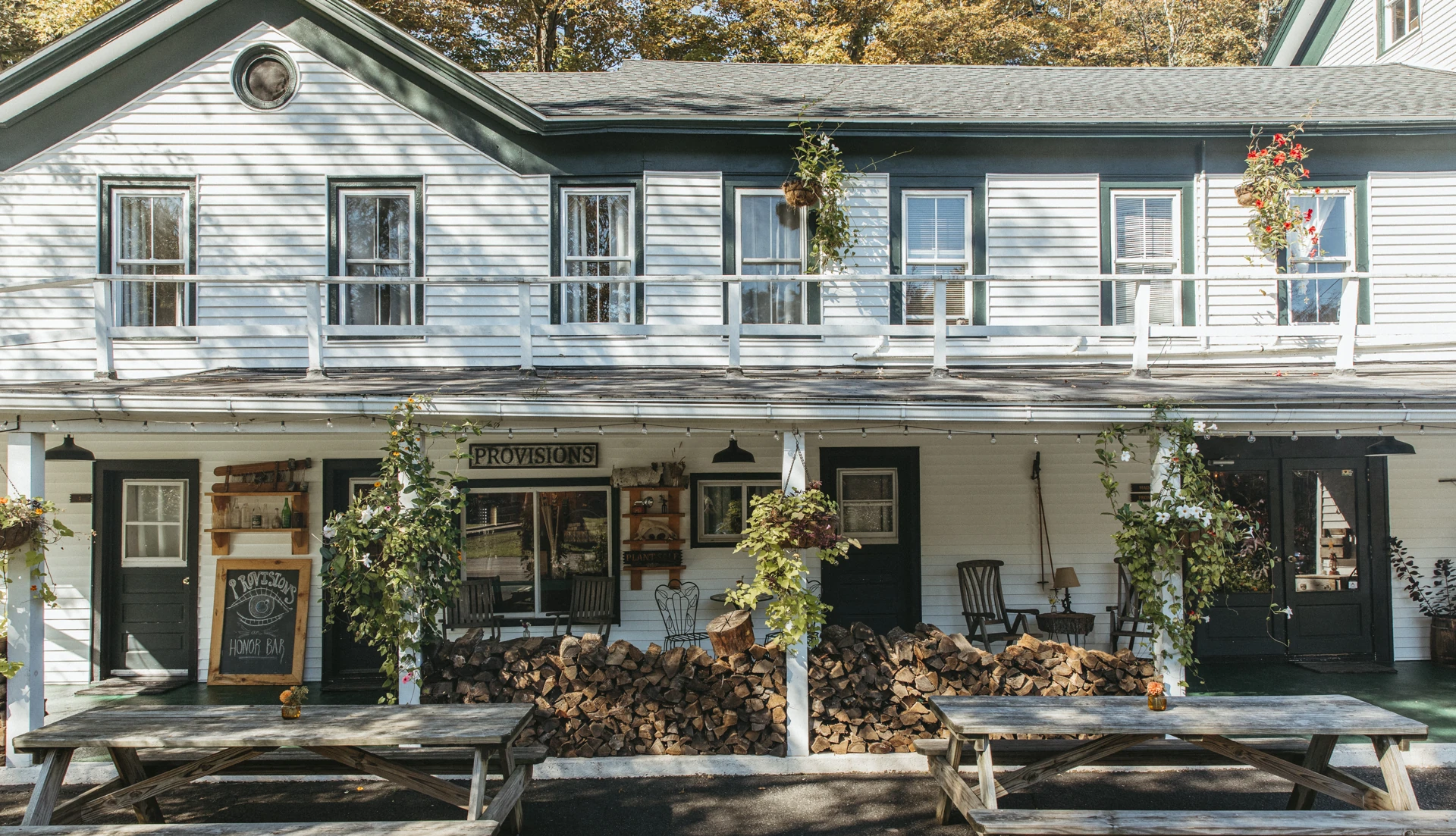 The front porch and outdoor tables at Glen Falls House